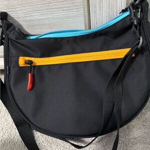Sherpani Black Crossbody with Yellow Zip and Turquoise Trim